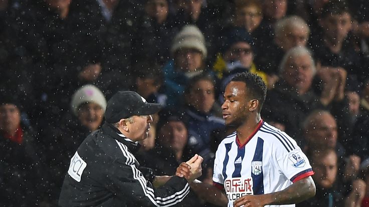 Saido Berahino of West Bromwich Albion shakes hands with manager Tony Pulis 