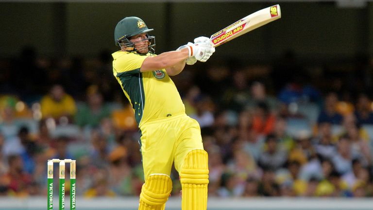BRISBANE, AUSTRALIA - JANUARY 15:  Aaron Finch of Australia hits the ball to the boundary for a four against India at the Gabba