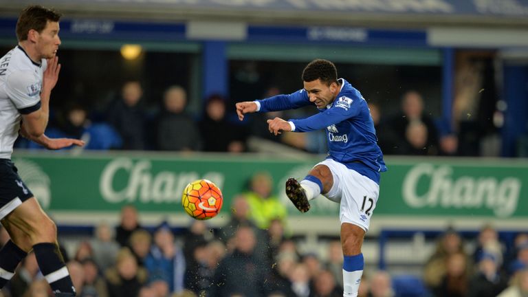 Everton's  Aaron Lennon shoots to score the opening goal of 