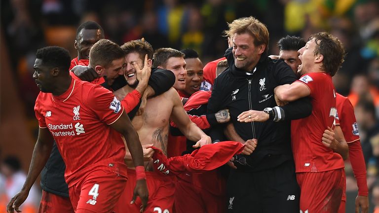 Liverpool's Adam Lallana (20) celebrates with his team-mates and manager Jurgen Klopp