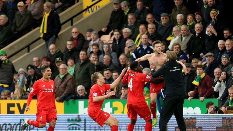 Adam Lallana (2nd R) of Liverpool ceelbrates scoring his team's fifth goal with his manager Jurgen Klopp