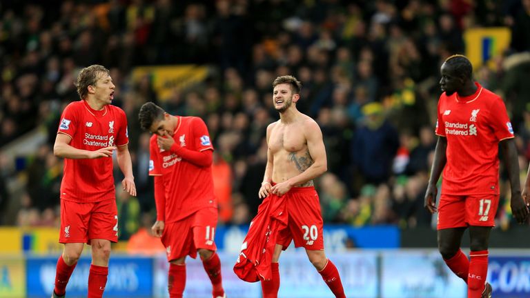  Adam Lallana of Liverpool (2nd R) celebrates scoring his team's fifth goal against Norwich