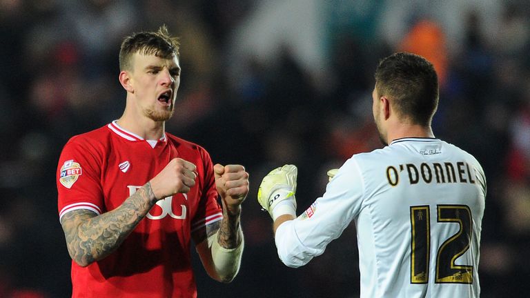 Aden Flint celebrates victory with Richard O'Donnell of Bristol City during the Sky Bet Championship match v Middlesbrough