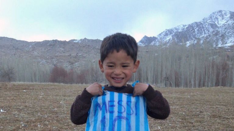 Murtaza Ahmadi, 5, with his plastic bag jersey 