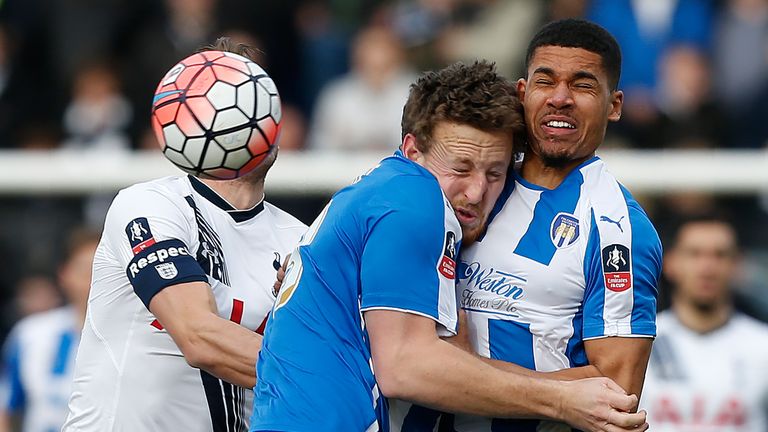 Colchester's Alex Wynter clashes heads with team-mate  Tom Eastman on Saturday