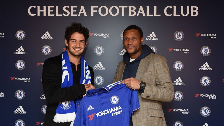 Chelsea's new signing Alexandre Pato holds the home shirt with technical director Michael Emenalo at the Cobham Training Ground