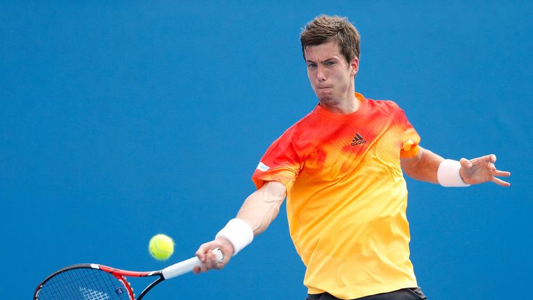 Aljaz Bedene plays a forehand in his first-round match against Steve Johnson at the 2016 Australian Open