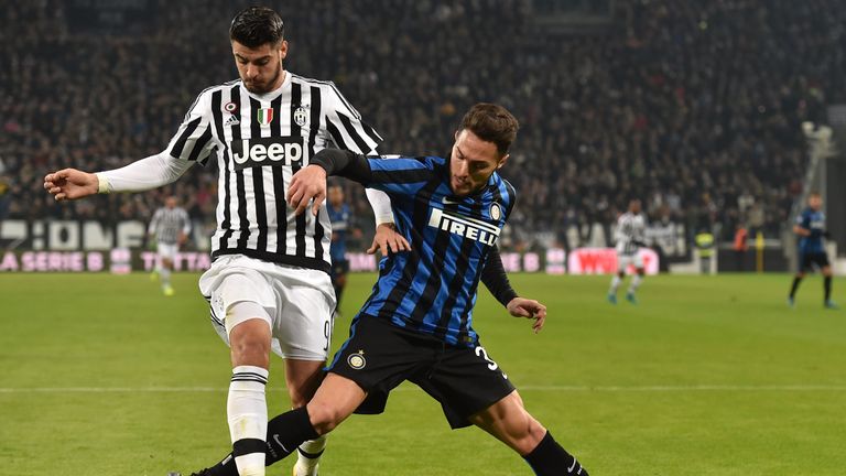 Alvaro Morata (L) of Juventus FC is challenged by Danilo D Ambrosio of Inter Milan