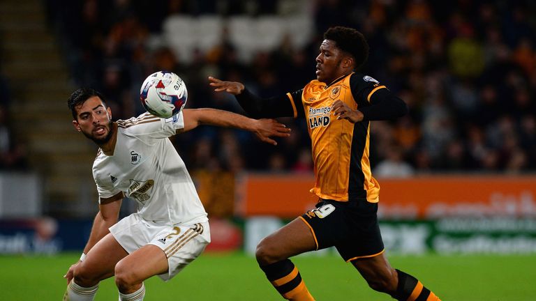 Jordi Amat (left) happy to continue life at Swansea