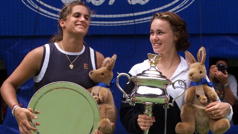 Amelie Mauresmo and champion Martina Hingis at the Australian Open trophy ceremony in 1999