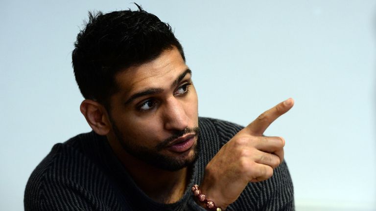 Boxer Amir Khan speaks to media during a visit to Fight Label who make his shorts on February 19, 2015 in Sheffield, Eng