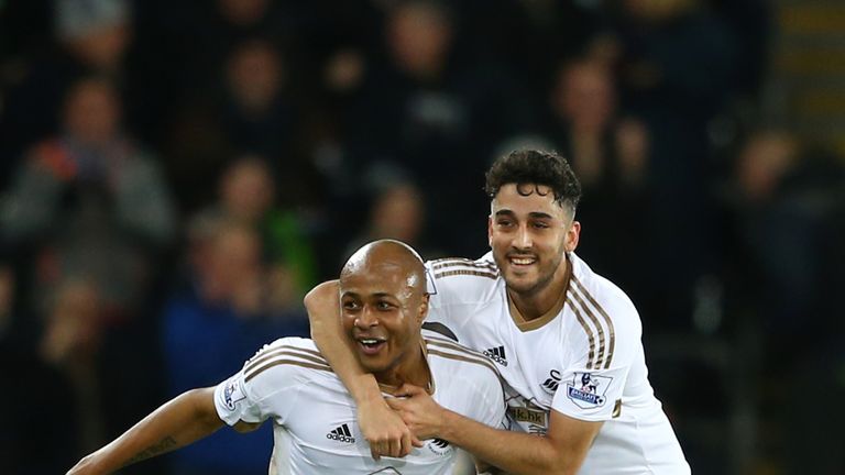  Andre Ayew (L) of Swansea City celebrates scoring his team's second goal with his team mate Neil Taylor (R) 