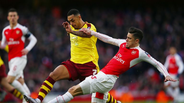 Andre Gray of Burnley and Gabriel of Arsenal compete for the ball during the Emirates FA Cup fourth round match 