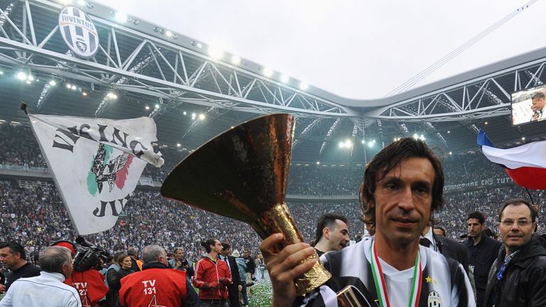 TURIN, ITALY - MAY 13:  Andrea Pirlo of Juventus FC celebrates with the Serie A trophy after the Serie A match between Juventus FC and Atalanta BC at Juven