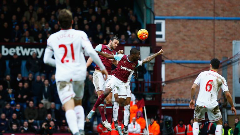 Andy Carroll (2nd L) scores West Ham's second goal against Liverpool