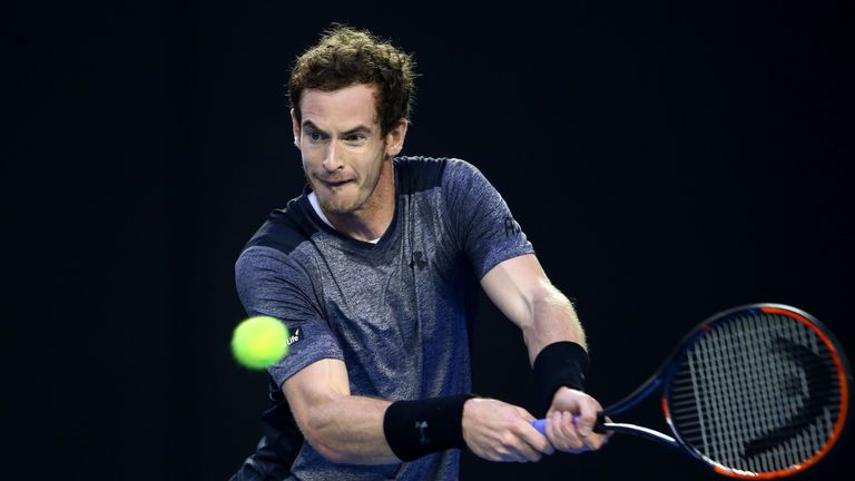 Andy Murray of Great Britain plays a backhand in his fourth round match against Bernard Tomic