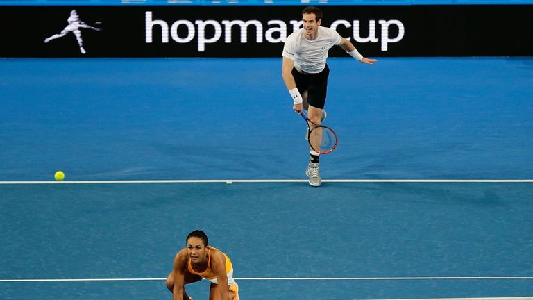 Andy Murray of Great Britain serves in the mixed doubles match against Daria Gavrilova and Nick Krygios of Australia Green 