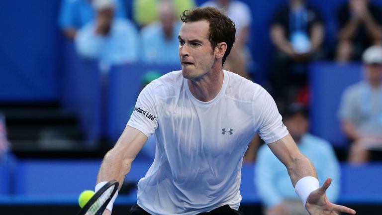 Britain plays a backhand in the men's single match against Nick Krygios of Australia Green during day 