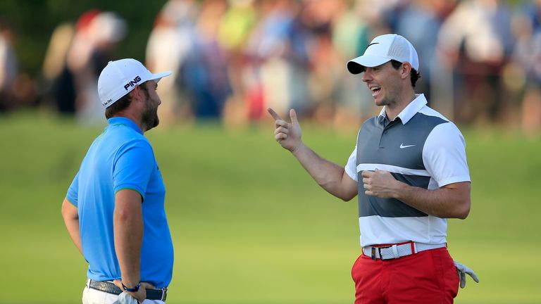 McIlroy jokes with Andy Sullivan as the pair jostled for the lead