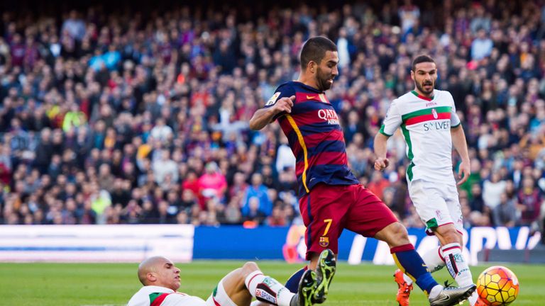 Matheus Doria of Granada CF tackles Arda Turan of FC Barcelona during the La Liga match in January 2016 at the Nou Camp