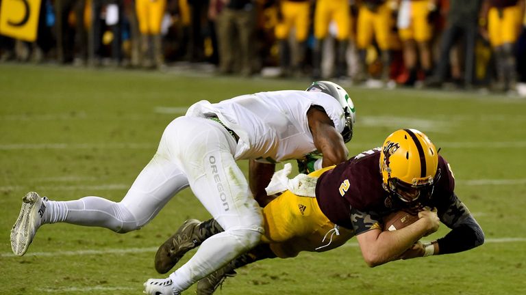 Mike Bercovici #2 of the Arizona State Sun Devils scores on a diving touchdown against the Oregon Ducks during overtime at Sun Dev