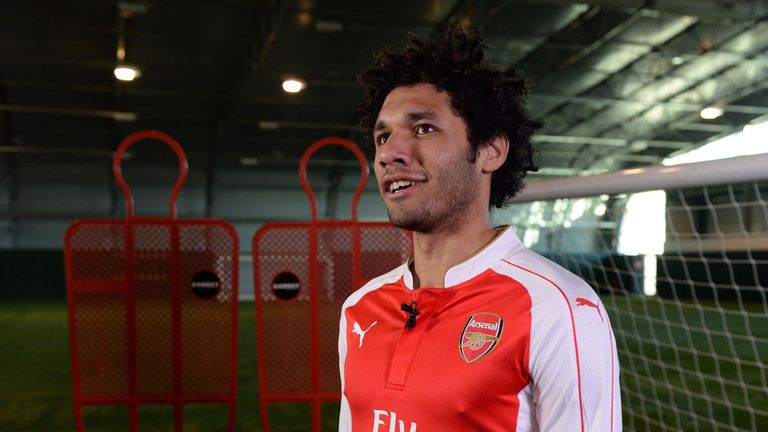 Mohamed Elneny signs for Arsenal at the club's London Colney training ground