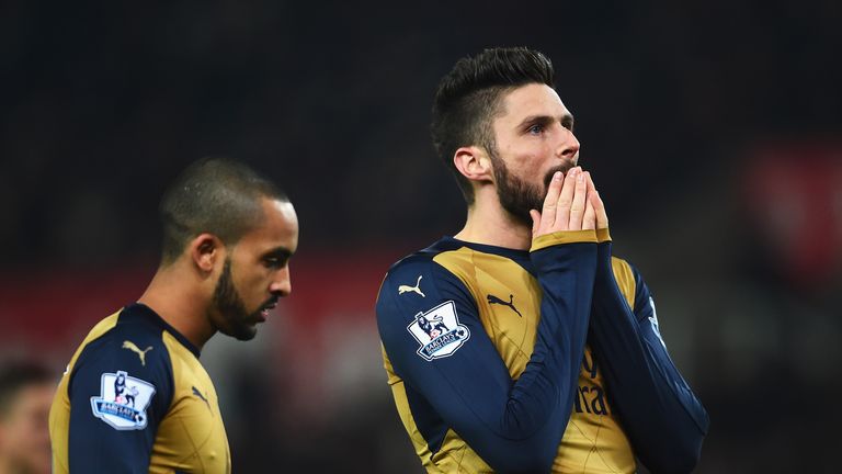 STOKE ON TRENT, ENGLAND - JANUARY 17:  Olivier Giroud (R) of Arsenal reacts after failing to score with Theo Walcott during the Barclays Premier League mat