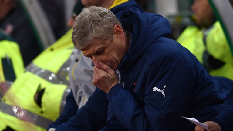 Wenger was confronted by a group of Arsenal fans as he boarded a train in Stoke