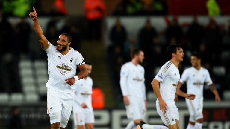 SWANSEA, WALES - JANUARY 18:  Ashley Williams of Swansea City celebrates after scoring the opening goal during the Barclays Premier League match between Sw