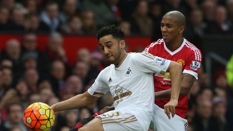 Ashley Young (R) in action with Neil Taylor (L) during the Barclays Premier League match between Manchester United and Swansea City