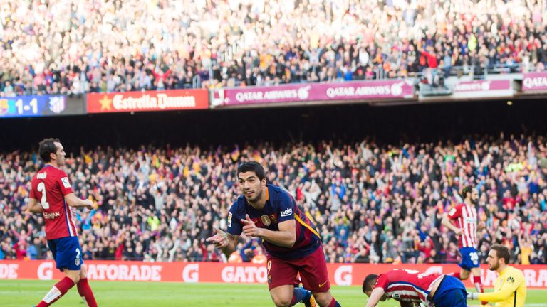 Luis Suarez celebrates after scoring for Barcelona against Atletico Madrid