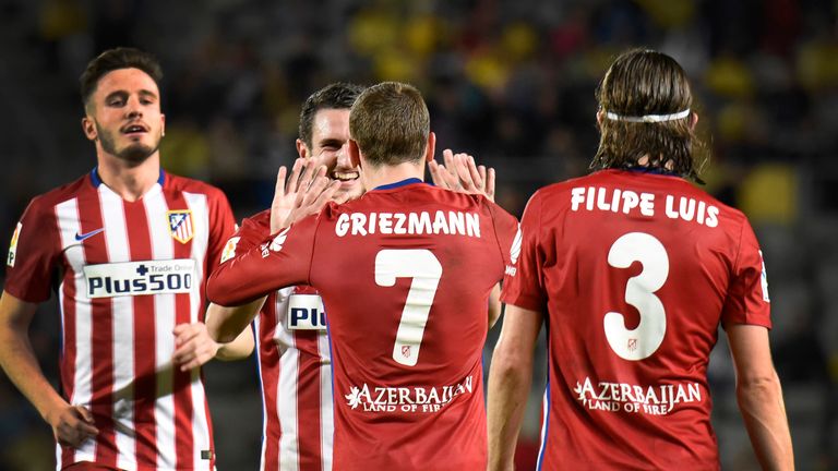 Atletico Madrid's French forward Antoine Griezmann (7) celebrates with teammates after scoring during the 