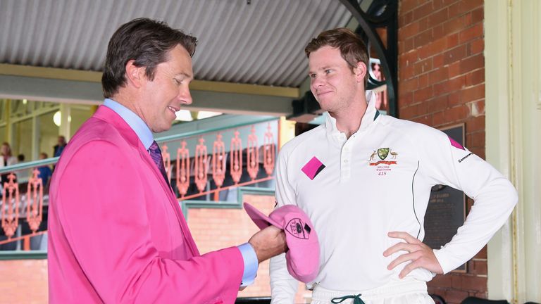 Australia captain Steve Smith presents Glenn McGrath with his pink cap on Jane McGrath Day during day three of the third Test v the West Indies