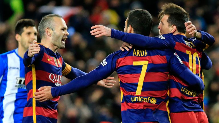 Barcelona's Lionel Messi celebrates with Arda Turan and Andres Iniesta