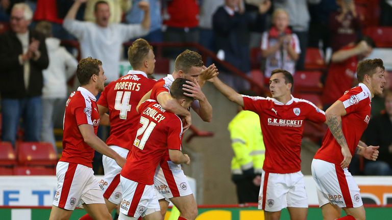 Barnsley's Marley Watkins celebrates scoring his sides second goal of the game with team mates during the Capital One Cup, second round match at Oakwell, B