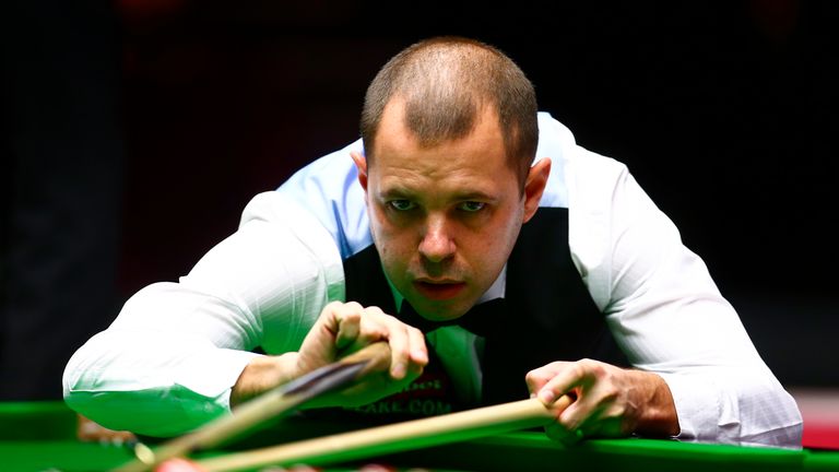 Barry Hawkins of England plays a shot during his first round match against Joe Perry in Masters at Alexandra Palace