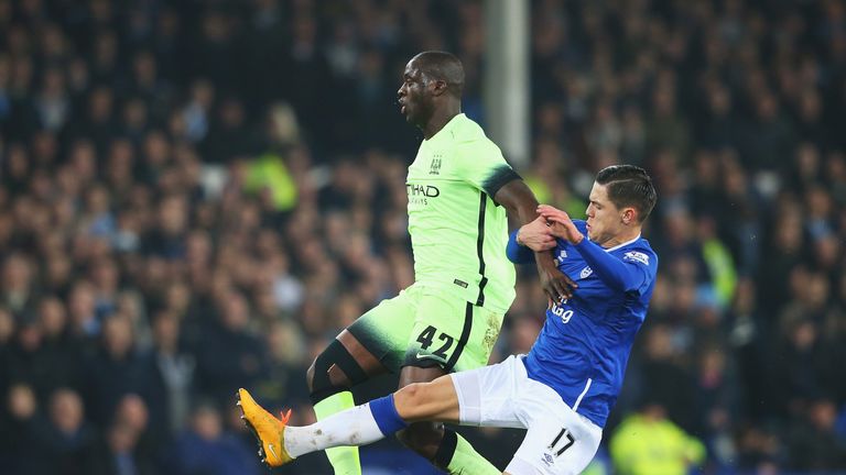Everton's Muhamed Besic tackles Man City's Yaya Toure