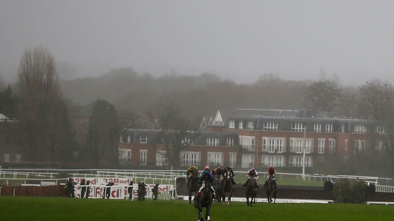Jamie Moore and Bishops Road come home clear of their rivals on a gloomy day at Sandown Park.