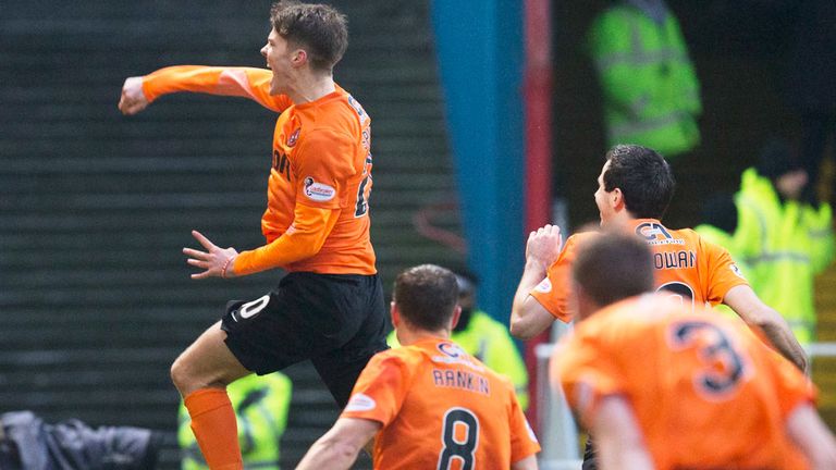 Blair Spittal celebrates his opening goal for Dundee United against Dundee