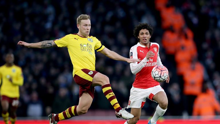 Burnley's Scott Arfield (left) and Arsenal's Mohamed Elneny battle for the ball during the Emirates FA Cup, fourth round match at the Emirates Stadium