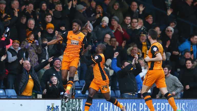 Chuba Akpom (left) of Hull City celebrates scoring his team's first goal against Bury