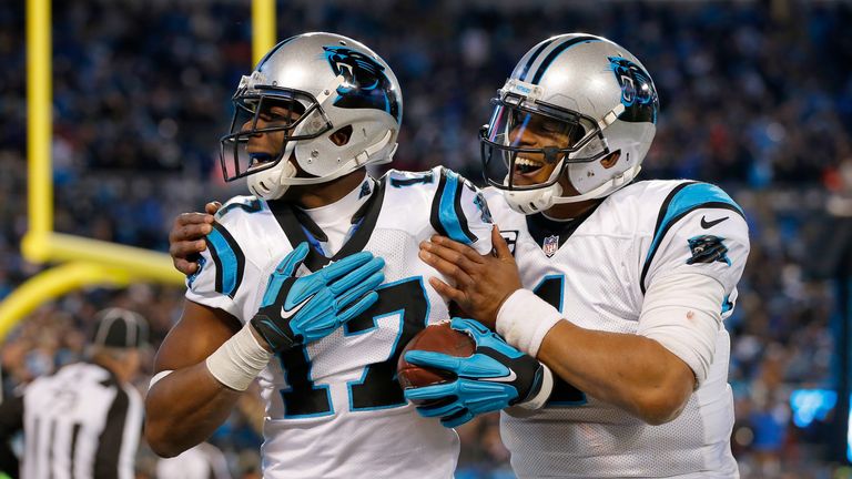 Cam Newton (L) threw two touchdowns and ran in two more for the Carolina Panthers