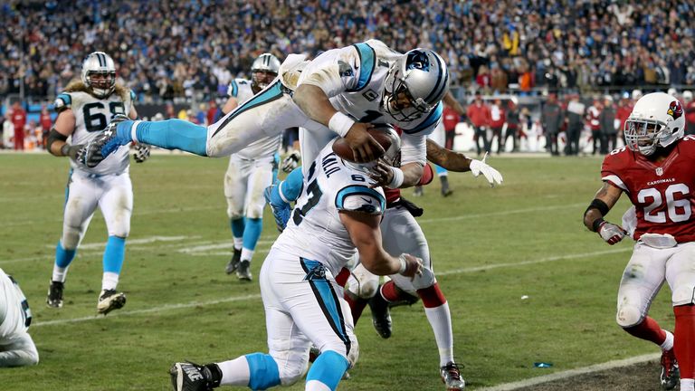 Newton dives in after a 12-yard run for his second touchdown