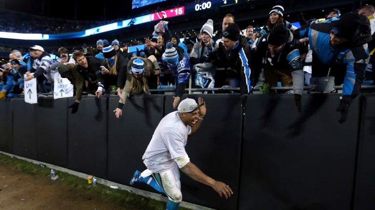 Newton celebrates with Carolina fans after defeating the Arizona Cardinals