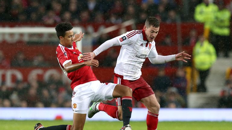 Manchester United's Cameron Borthwick-Jackson and Sheffield United's Paul Coutts