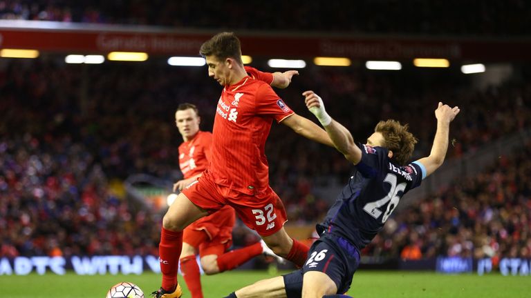 Cameron Brannagan of Liverpool is tackled by West Ham's Nikica Jelavic 
