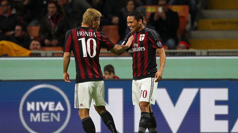 Carlos Bacca (R) of AC Milan celebrates with his team-mate Keisuke Honda (L) after scoring the opening goal v Carpi, Coppa Italia