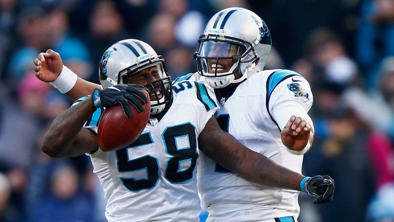 CHARLOTTE, NC - JANUARY 17:  Cam Newton #1 and Thomas Davis of the Carolina Panthers celebrate their win after defeating the Seattle Seahawks 31-24 in the 