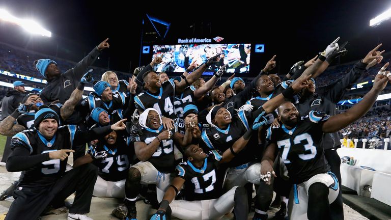  Cam Newton #1 of the Carolina Panthers organizes a team photo in the bench area 