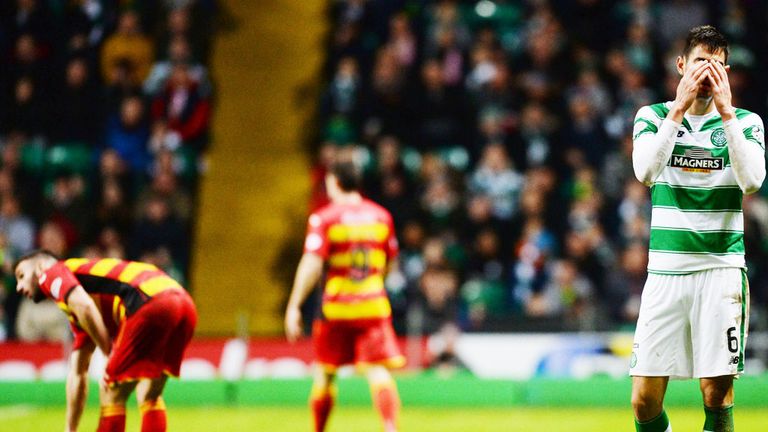 Celtic's Nir Bitton has just been dismissed for his challenge on the grounded Gary Miller of Partick
